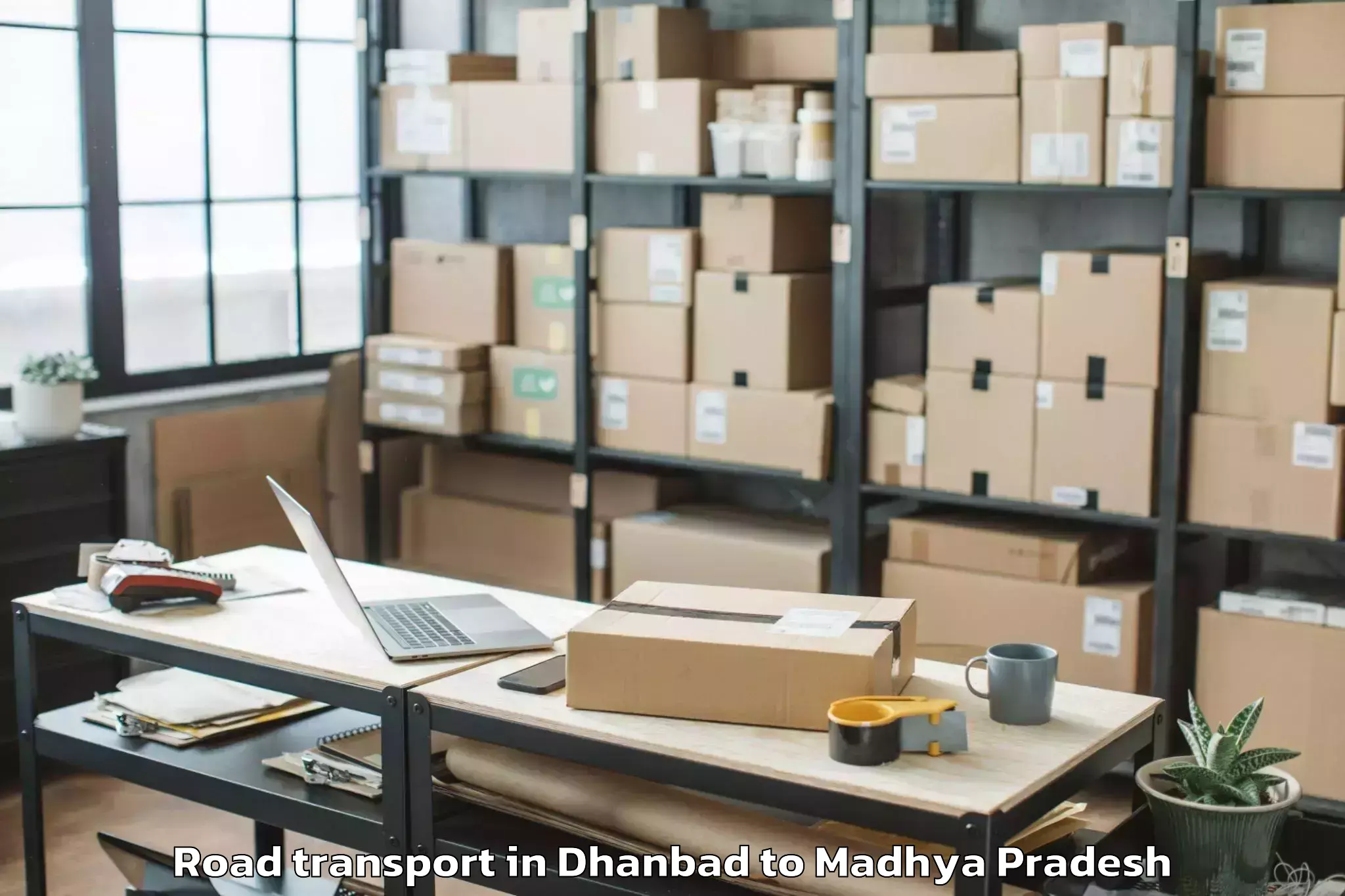 Book Dhanbad to Malwanchal University Indore Road Transport Online